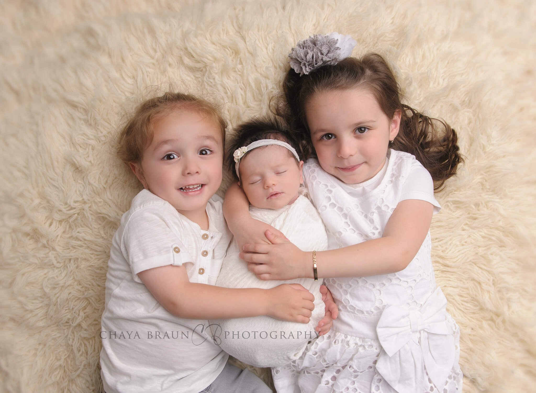 newborn baby and sister and brother photo