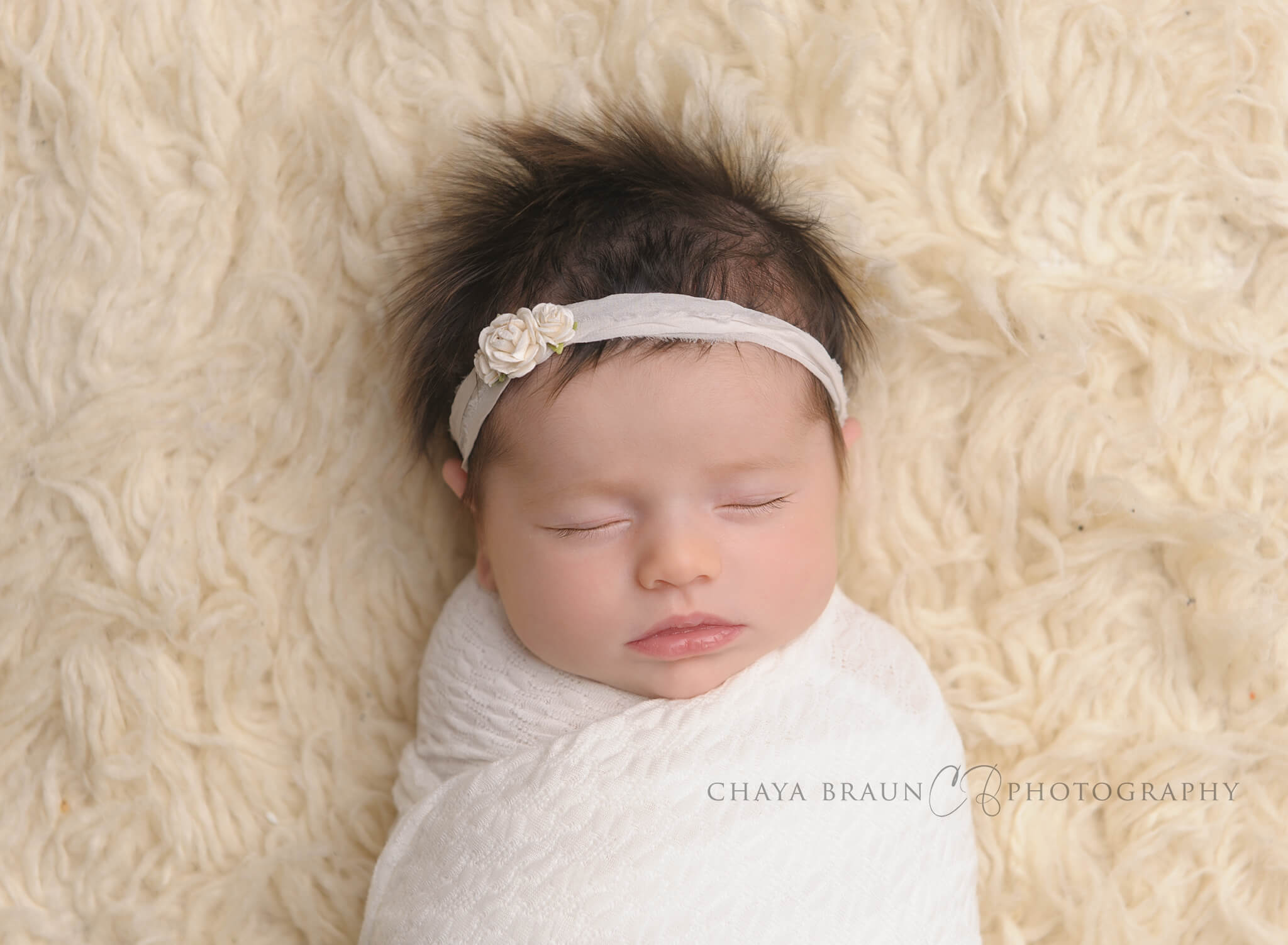 newborn baby with long gorgeous hair