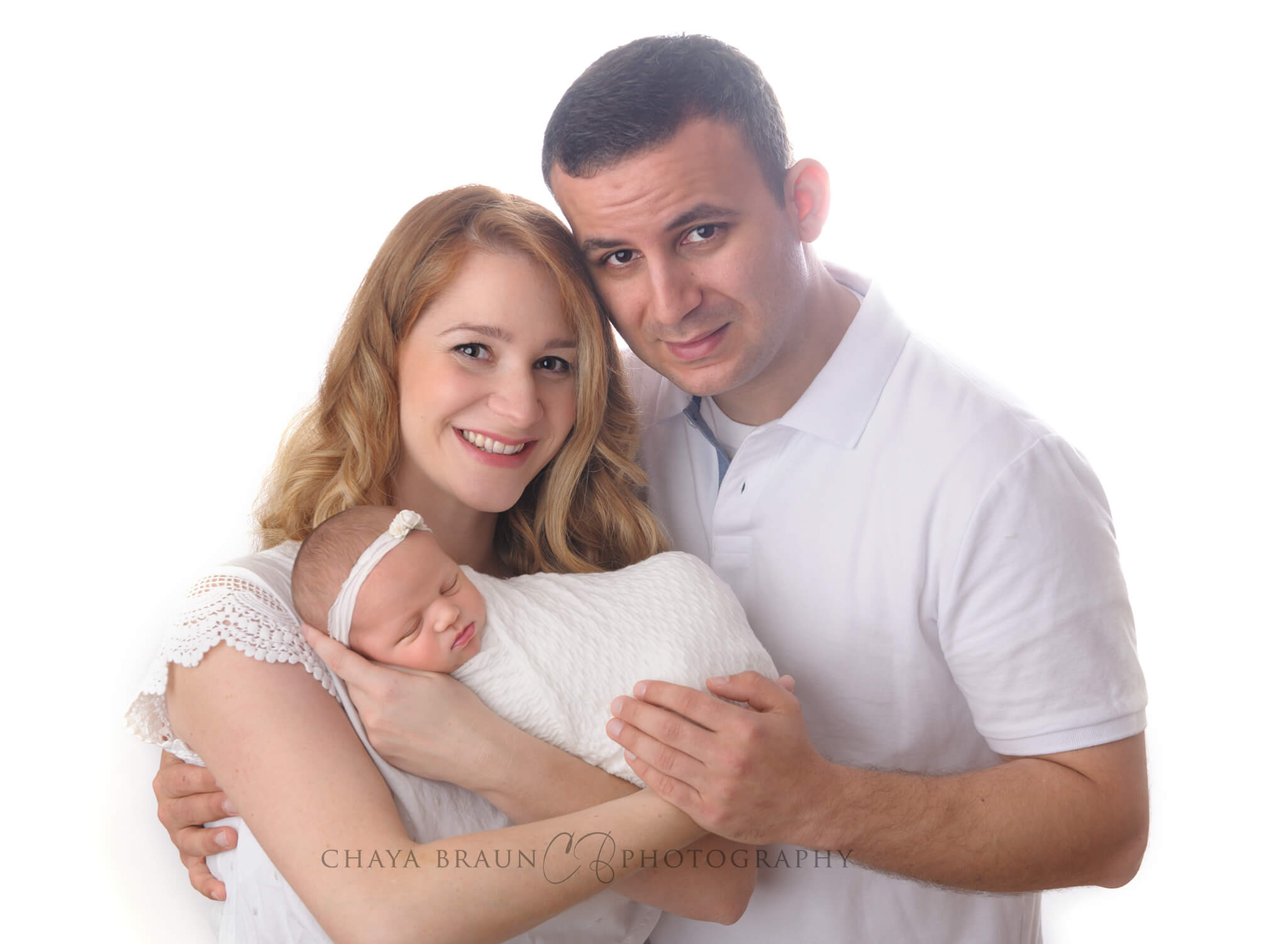mom and dad and newborn baby professional photographer