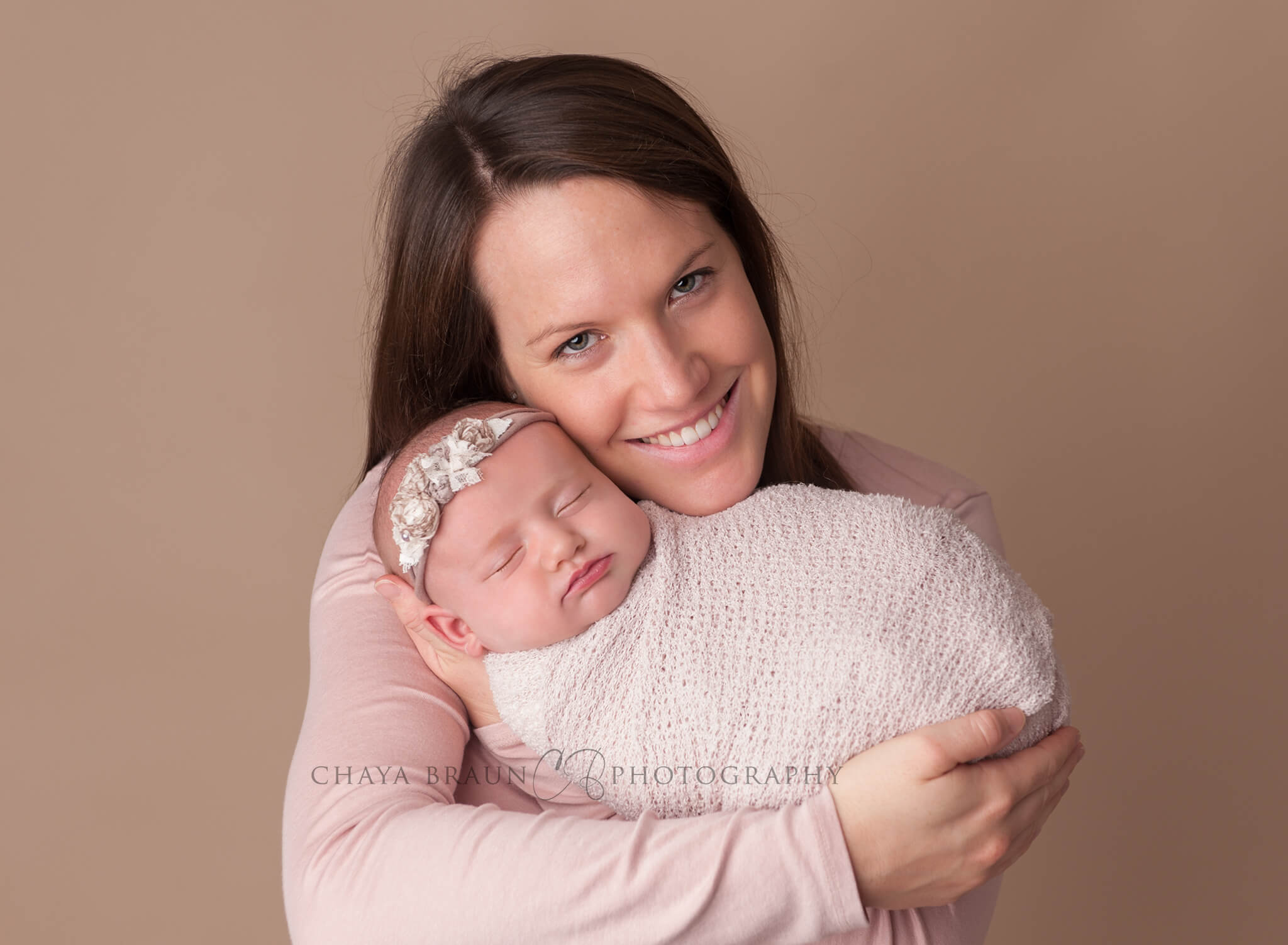 mother and newborn baby pose