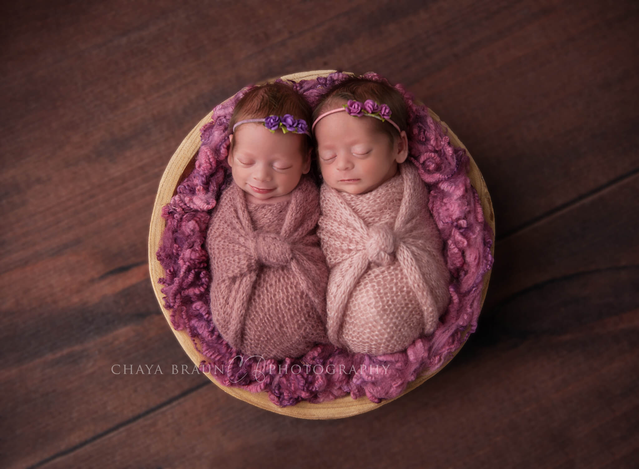 smiling twin newborn babies