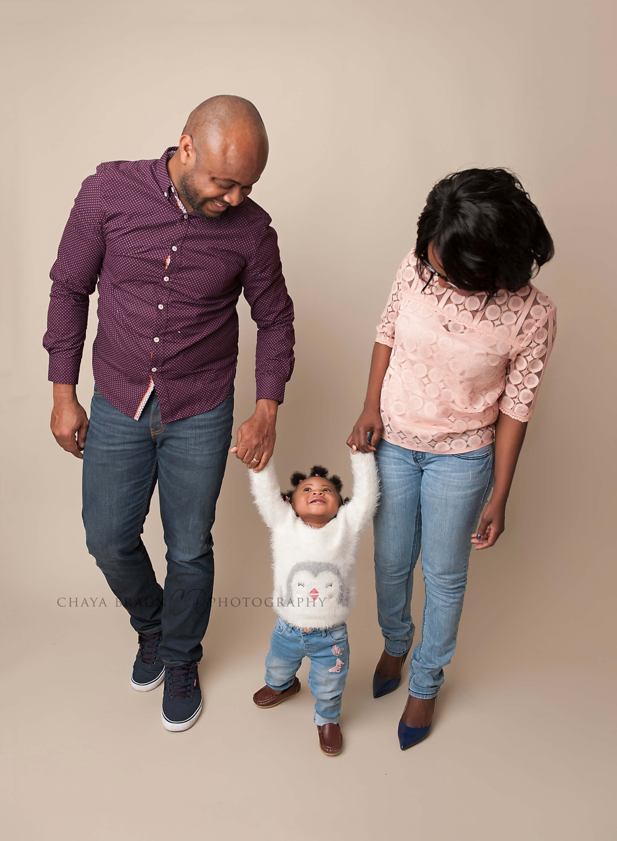 family with one year old birthday girl