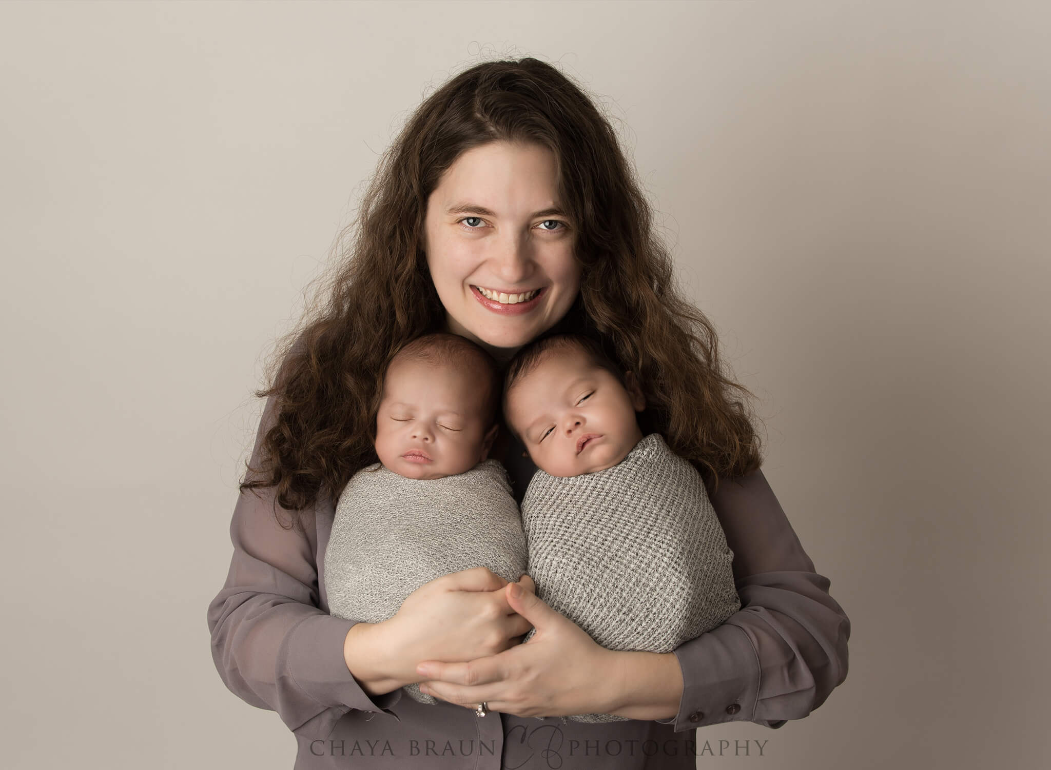 mom holding newborn twins