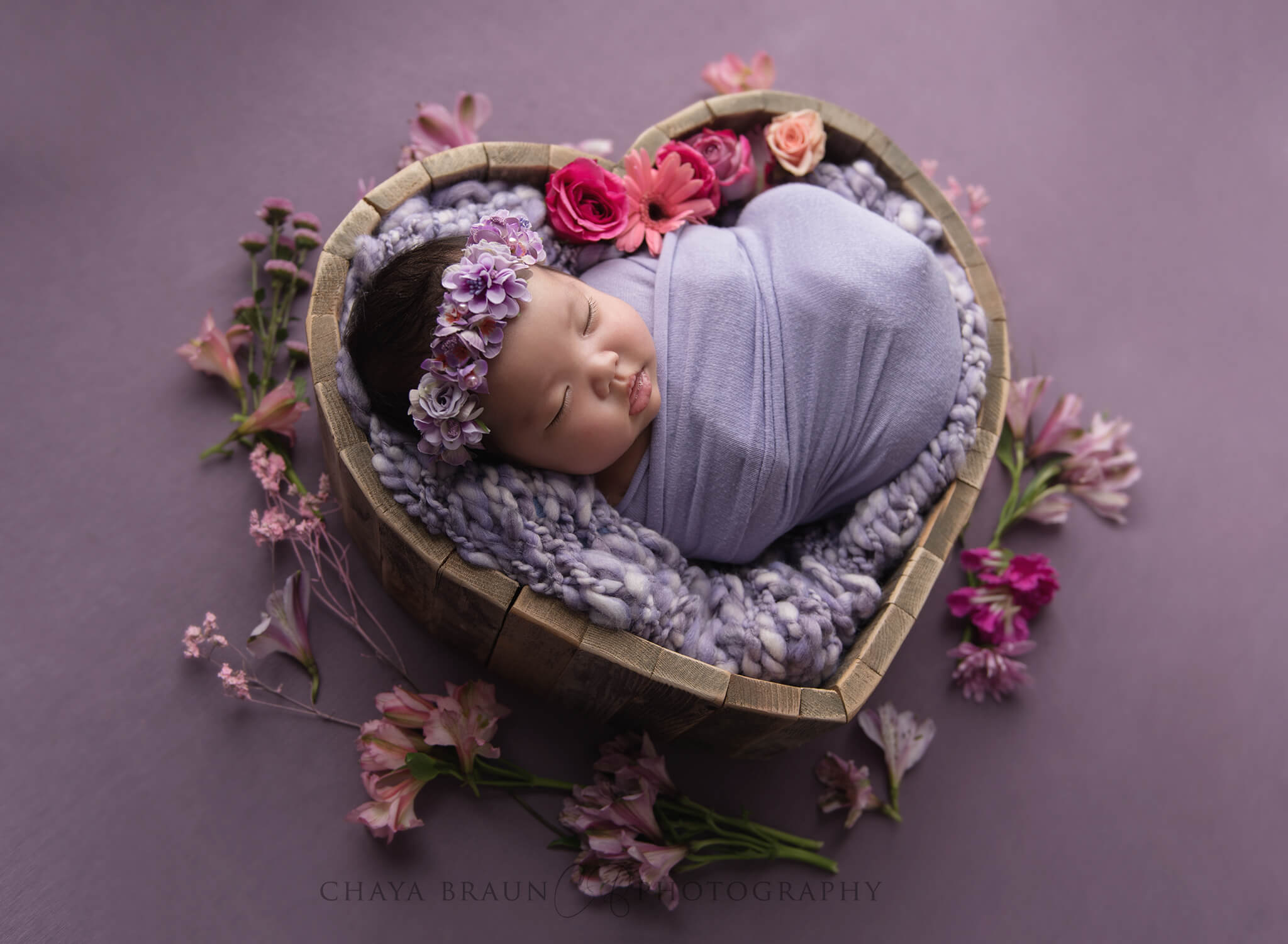newborn baby in heart bowl